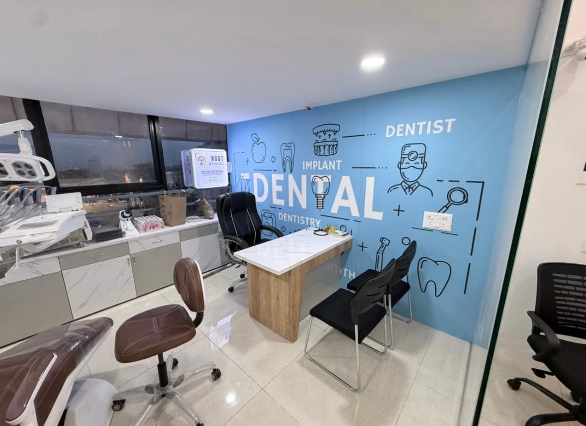 Consultation desk in the treatment room with the doctor's illustrated mural on the wall behind